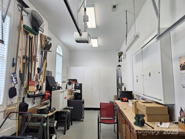 garage featuring a garage door opener