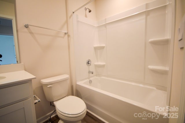 bathroom featuring vanity, toilet, and shower / bathtub combination
