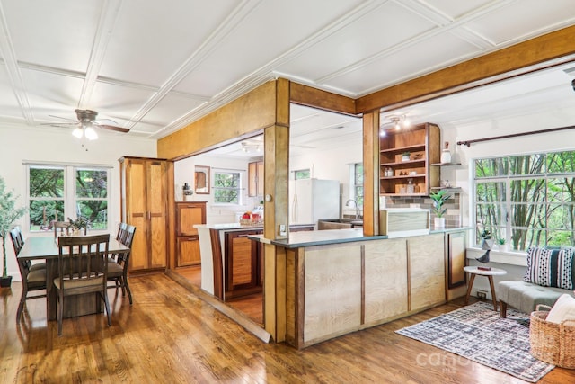 108 Patton Hill Rd, Swannanoa, NC 28778 - kitchen with wood finished floors, ceiling fan, a peninsula, crown molding, and freestanding refrigerator