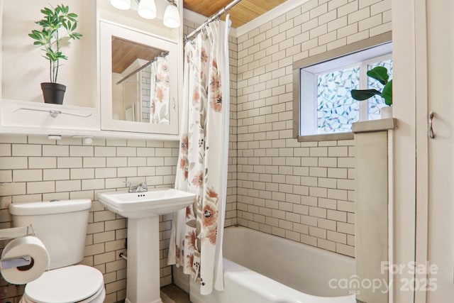 108 Patton Hill Rd, Swannanoa, NC 28778 - bathroom with tile walls, shower / bath combo with shower curtain, toilet, and a sink