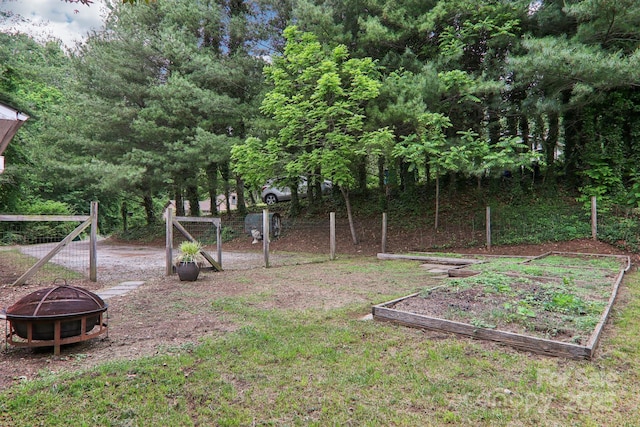 108 Patton Hill Rd, Swannanoa, NC 28778 - view of yard featuring a fire pit and a vegetable garden