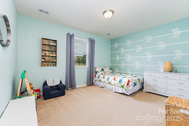 bedroom with visible vents and carpet floors
