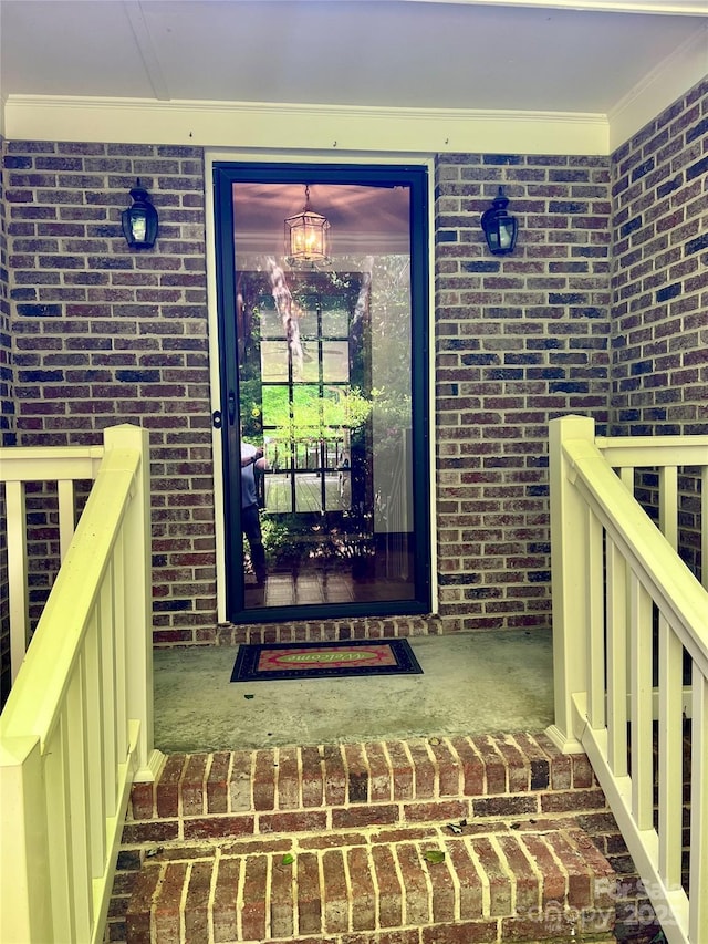 entrance to property with brick siding