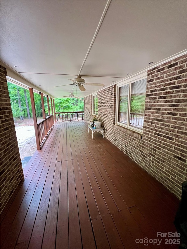 deck featuring a porch and ceiling fan