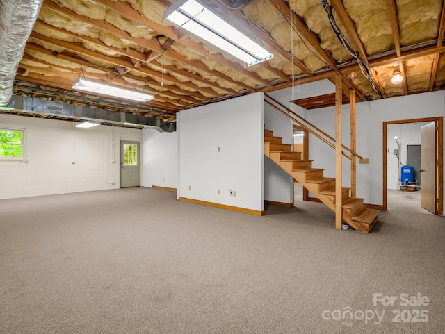 163 Summit Ln, Rutherfordton, NC 28139 - below grade area with stairs, carpet flooring, and plenty of natural light