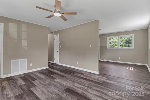 empty room featuring ceiling fan, crown molding, dark wood-style floors, and baseboards
