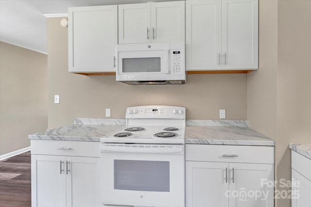 kitchen featuring white appliances, dark wood-style flooring, and white cabinets