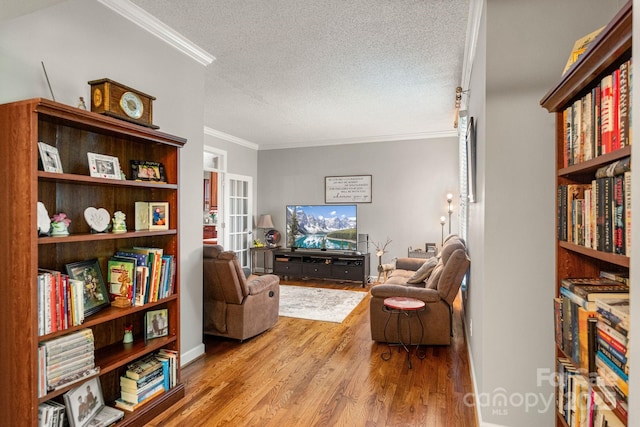 104 Belvedere Dr, Morganton, NC 28655 - living room featuring wood finished floors, ornamental molding, and a textured ceiling