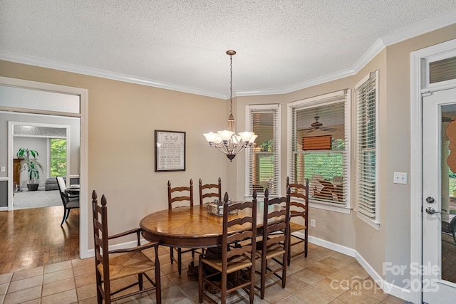 104 Belvedere Dr, Morganton, NC 28655 - dining room featuring ornamental molding, baseboards, a chandelier, a textured ceiling, and light tile patterned floors
