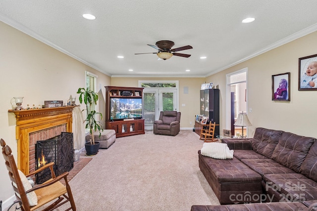 104 Belvedere Dr, Morganton, NC 28655 - living room with ceiling fan, carpet flooring, ornamental molding, recessed lighting, and a brick fireplace