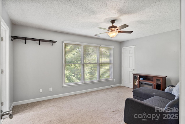 104 Belvedere Dr, Morganton, NC 28655 - sitting room featuring a ceiling fan, baseboards, carpet, and a textured ceiling