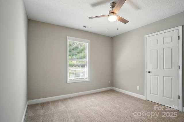 8309 Emily Dr, Harrisburg, NC 28075 - carpeted spare room featuring a textured ceiling, ceiling fan, and baseboards
