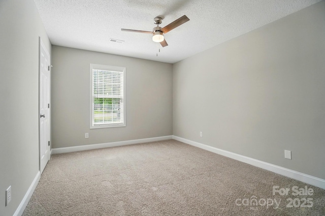 8309 Emily Dr, Harrisburg, NC 28075 - carpeted empty room featuring a ceiling fan, a textured ceiling, and baseboards