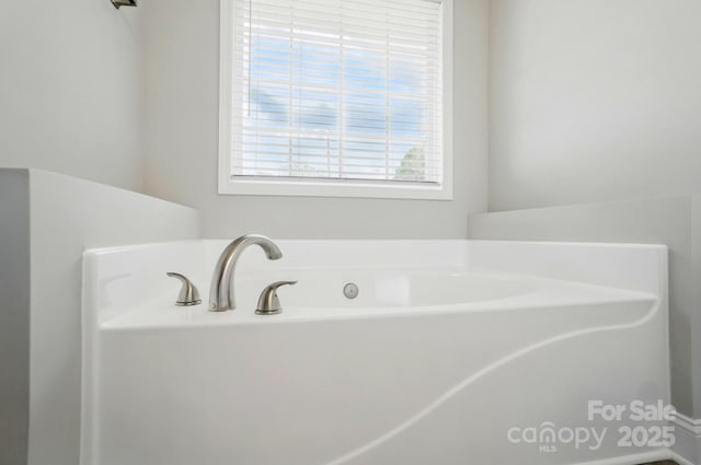 full bathroom with a bath