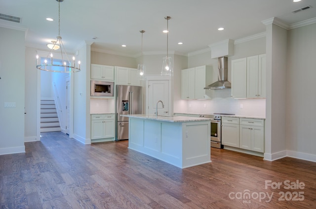 kitchen with appliances with stainless steel finishes, visible vents, dark wood-style flooring, and wall chimney exhaust hood