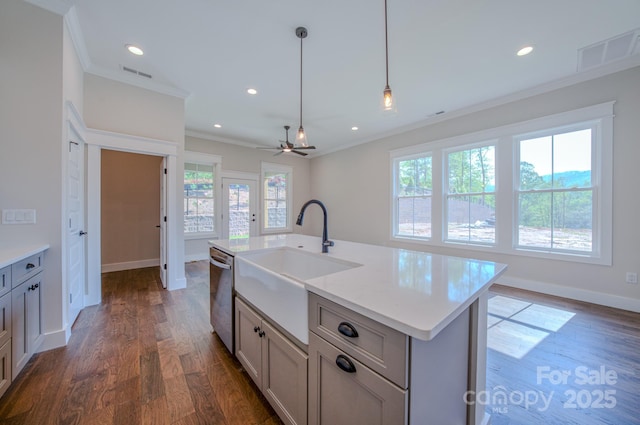 kitchen featuring a sink, crown molding, a wealth of natural light, stainless steel dishwasher, and visible vents