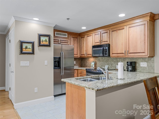 kitchen featuring a peninsula, ornamental molding, visible vents, light stone countertops, and stainless steel fridge with ice dispenser