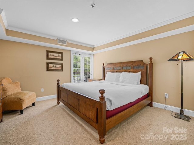 bedroom featuring baseboards, carpet flooring, ornamental molding, and visible vents