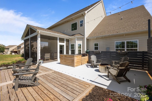 9871 Travertine Trl, Davidson, NC 28036 - wooden deck featuring a sunroom, an outdoor fire pit, and a patio