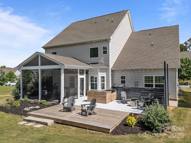 9871 Travertine Trl, Davidson, NC 28036 - rear view of property featuring a sunroom, a wooden deck, and a shingled roof
