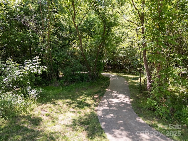 9871 Travertine Trl, Davidson, NC 28036 - view of street featuring a forest view