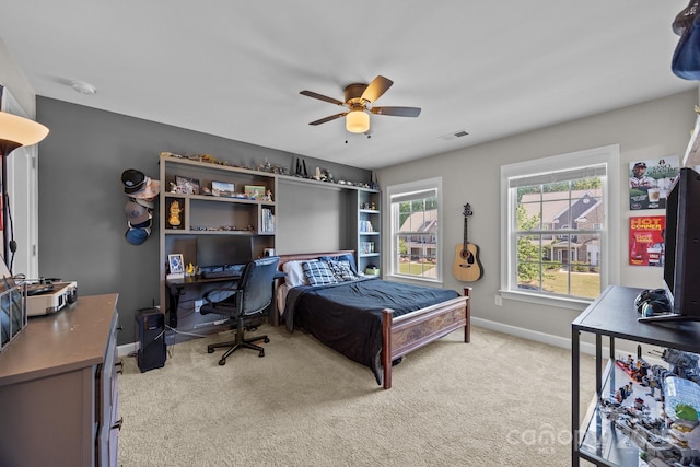 9871 Travertine Trl, Davidson, NC 28036 - bedroom with an office area, light colored carpet, baseboards, and a ceiling fan