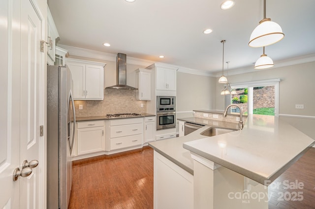 4324 Falls Lake Dr SW, Concord, NC 28025 - kitchen with stainless steel appliances, wall chimney exhaust hood, a sink, crown molding, and backsplash
