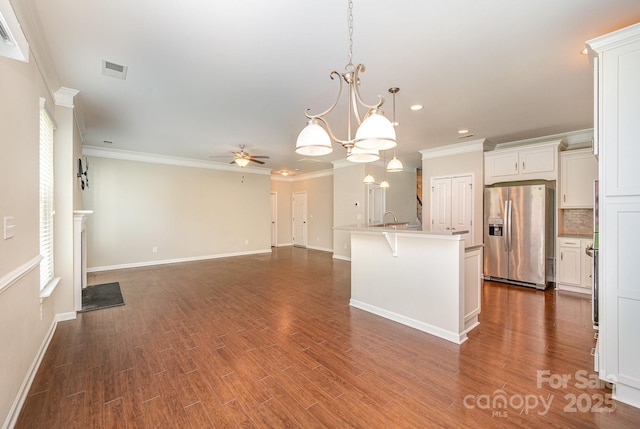 4324 Falls Lake Dr SW, Concord, NC 28025 - kitchen with stainless steel refrigerator with ice dispenser, a ceiling fan, crown molding, white cabinets, and open floor plan