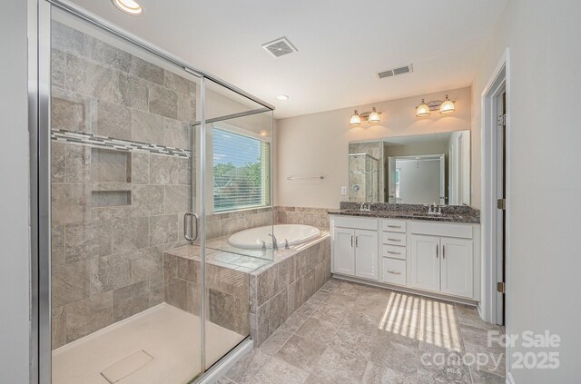 4324 Falls Lake Dr SW, Concord, NC 28025 - full bath with a bath, double vanity, and a shower stall