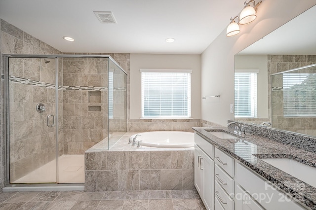 4324 Falls Lake Dr SW, Concord, NC 28025 - bathroom with a bath, double vanity, a stall shower, and recessed lighting