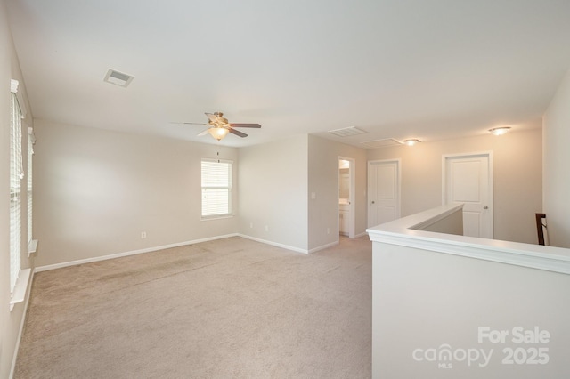 4324 Falls Lake Dr SW, Concord, NC 28025 - empty room with light carpet, baseboards, and a ceiling fan