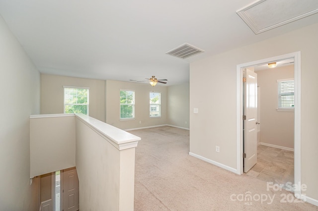 4324 Falls Lake Dr SW, Concord, NC 28025 - hallway with an upstairs landing, light colored carpet, and baseboards