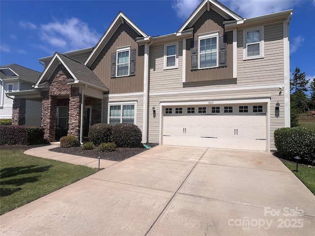 14837 Dungannon Ct, Charlotte, NC 28278 - view of front of house with board and batten siding, driveway, a garage, and stone siding
