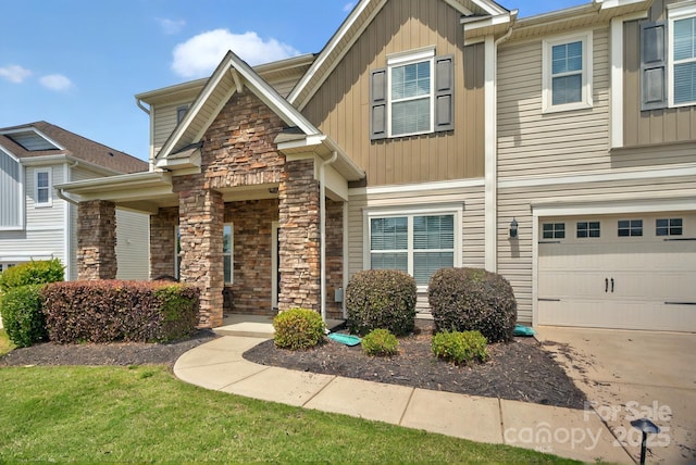 14837 Dungannon Ct, Charlotte, NC 28278 - view of front facade featuring stone siding, an attached garage, and driveway