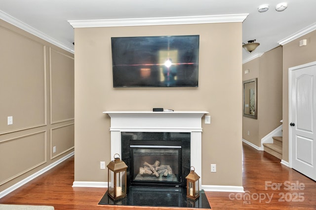 14837 Dungannon Ct, Charlotte, NC 28278 - detailed view of wood finished floors, ornamental molding, a smoke detector, and a fireplace