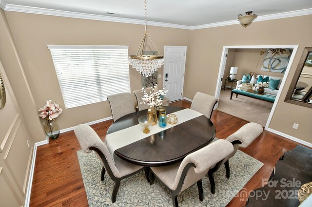 14837 Dungannon Ct, Charlotte, NC 28278 - dining room featuring ornamental molding, wood finished floors, and baseboards