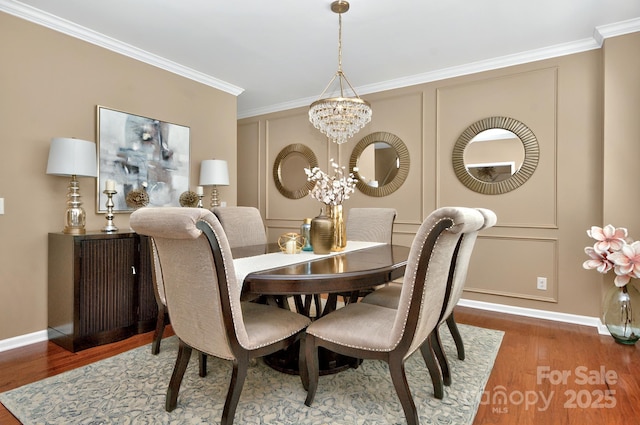 14837 Dungannon Ct, Charlotte, NC 28278 - dining area with a chandelier, wood finished floors, ornamental molding, and baseboards