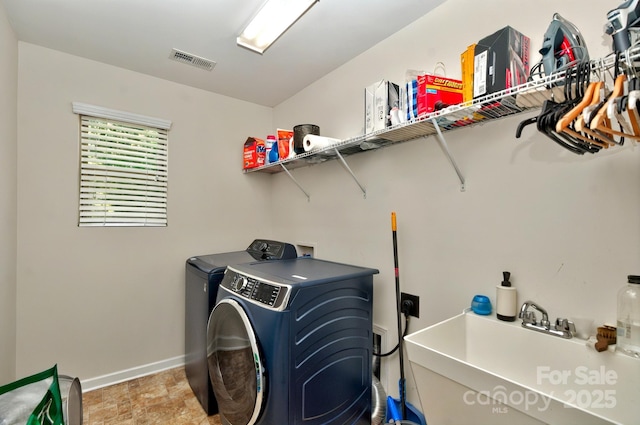 14837 Dungannon Ct, Charlotte, NC 28278 - laundry area featuring separate washer and dryer and baseboards