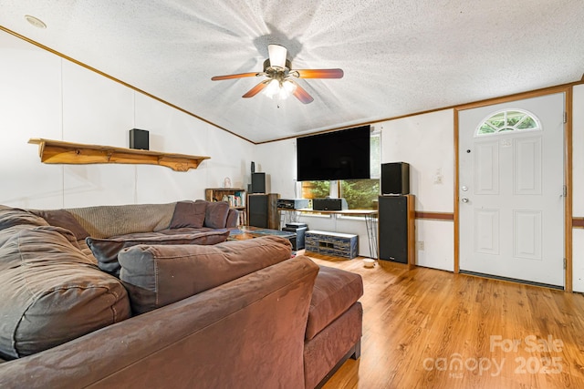 15 Robin Ln, Asheville, NC 28806 - living area with vaulted ceiling, a textured ceiling, a ceiling fan, light wood-style floors, and ornamental molding