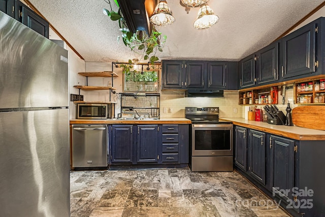 15 Robin Ln, Asheville, NC 28806 - kitchen featuring appliances with stainless steel finishes, a textured ceiling, under cabinet range hood, open shelves, and backsplash