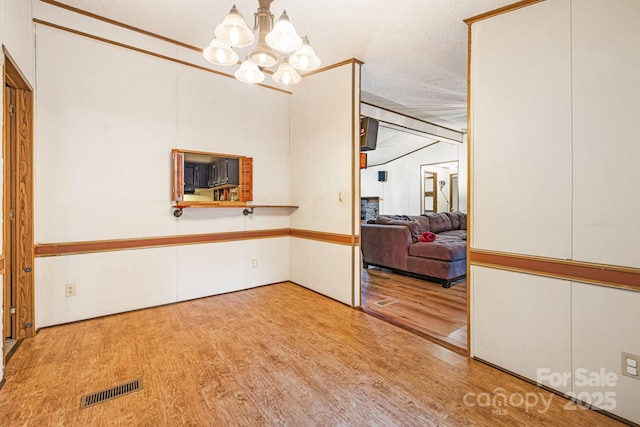 15 Robin Ln, Asheville, NC 28806 - empty room featuring a chandelier and wood finished floors