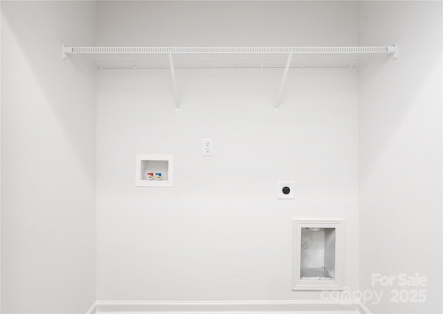 laundry area with laundry area, baseboards, washer hookup, and electric dryer hookup