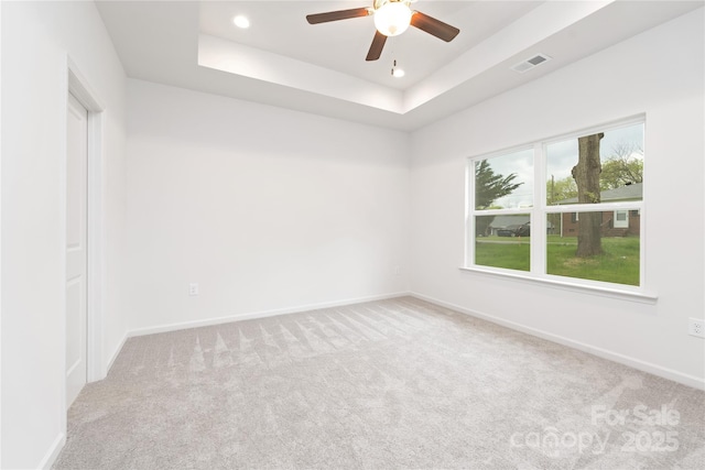 carpeted spare room with ceiling fan, baseboards, visible vents, and recessed lighting