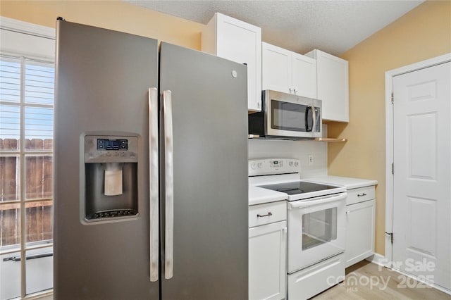 1162 Willet Dr, Rock Hill, SC 29732 - kitchen featuring appliances with stainless steel finishes, light countertops, white cabinets, and a textured ceiling