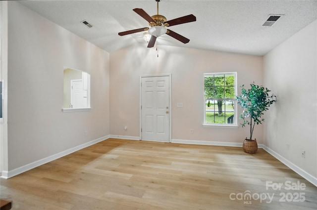 1162 Willet Dr, Rock Hill, SC 29732 - spare room featuring lofted ceiling, ceiling fan, light wood-type flooring, and baseboards