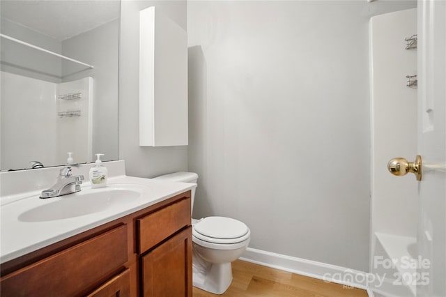 1162 Willet Dr, Rock Hill, SC 29732 - bathroom featuring wood finished floors, toilet, vanity, baseboards, and a shower