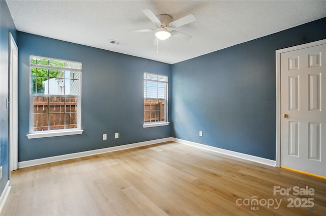 1162 Willet Dr, Rock Hill, SC 29732 - spare room featuring wood finished floors, ceiling fan, baseboards, and a textured ceiling