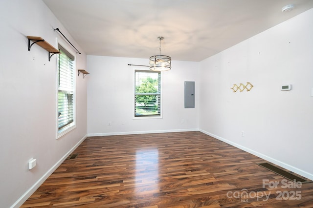 92 Le-An-Hurst Rd, Asheville, NC 28803 - empty room featuring plenty of natural light, electric panel, dark wood-style floors, and a chandelier