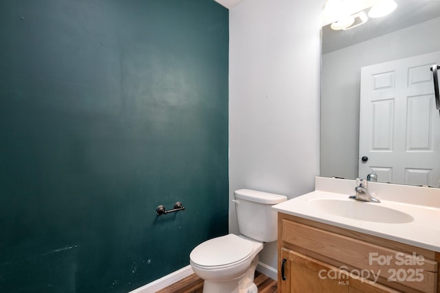 92 Le-An-Hurst Rd, Asheville, NC 28803 - bathroom featuring wood finished floors, toilet, vanity, and baseboards