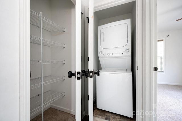 92 Le-An-Hurst Rd, Asheville, NC 28803 - washroom featuring stacked washer / drying machine, baseboards, and carpet